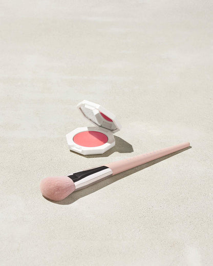 Cheeks Out Freestyle Cream Blush shown in shade Petal Poppin with Face Shaping Brush 125