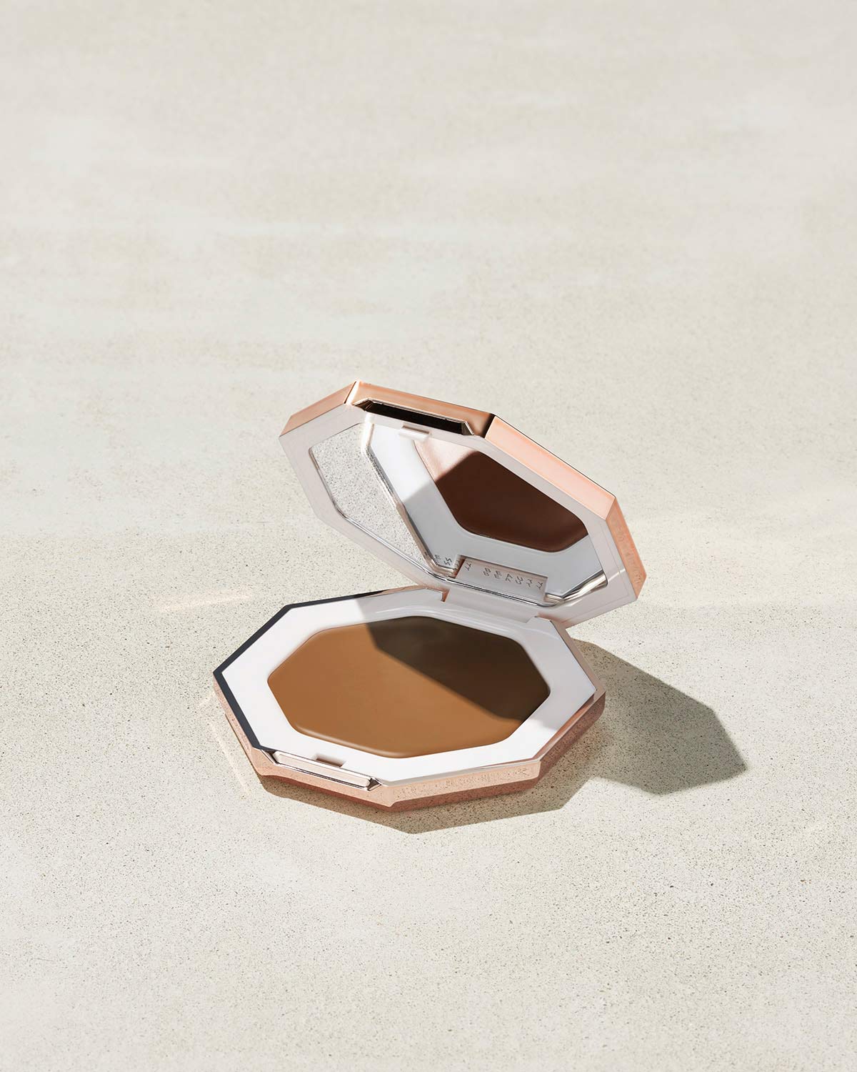 Cheeks Out Freestyle Cream Bronzer shown in shade Teddy
