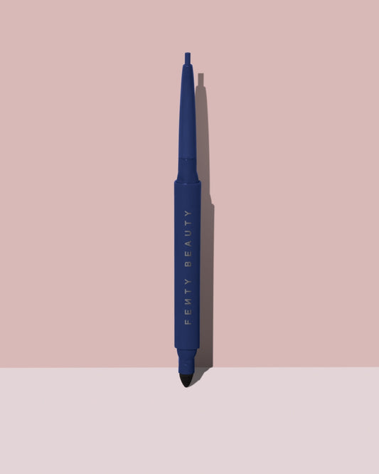 Fine Linez Lash Line-Enhancing Eyeliner in shade 'The Navy' open capped product shot on a two-tone pink background.